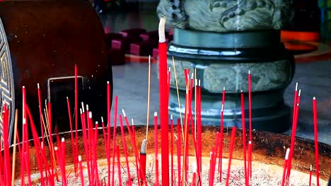 burning incense at temple