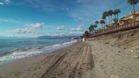 Aerial-backwards-flying-near-the-beach