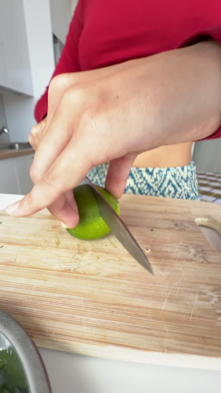Woman cutting limes