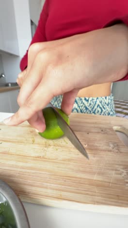 woman cutting limes