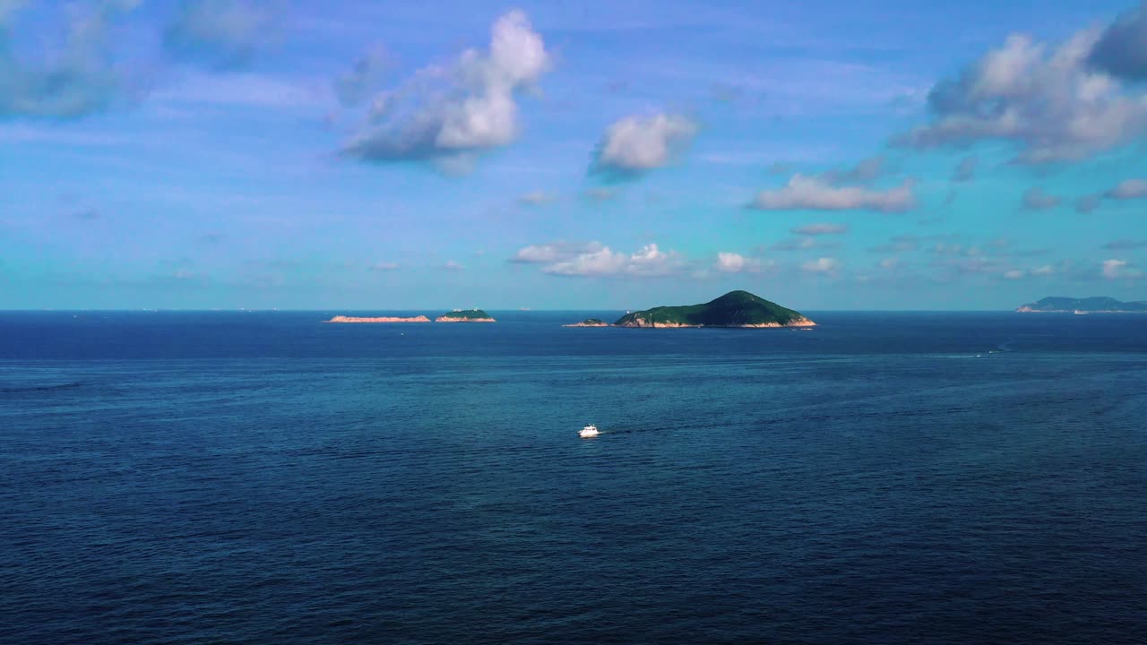 Aerial view during flyover around the Shek-O beach shore area in Hong Kong Peninsular. Aerial, beautiful seascape and a view on a small islands.