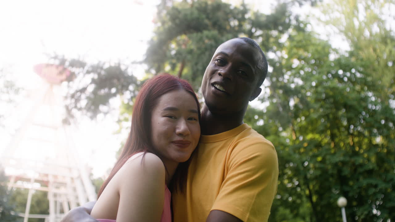 Couple hugging outdoors