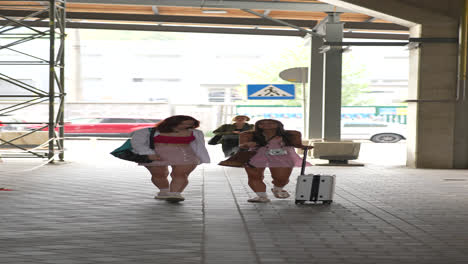 two young women walking outdoors