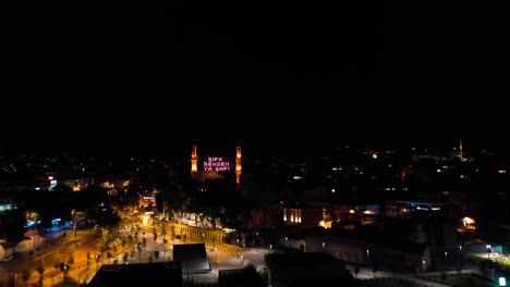 aerial night view of mihrimah sultan mosque. there says "healing is from god"