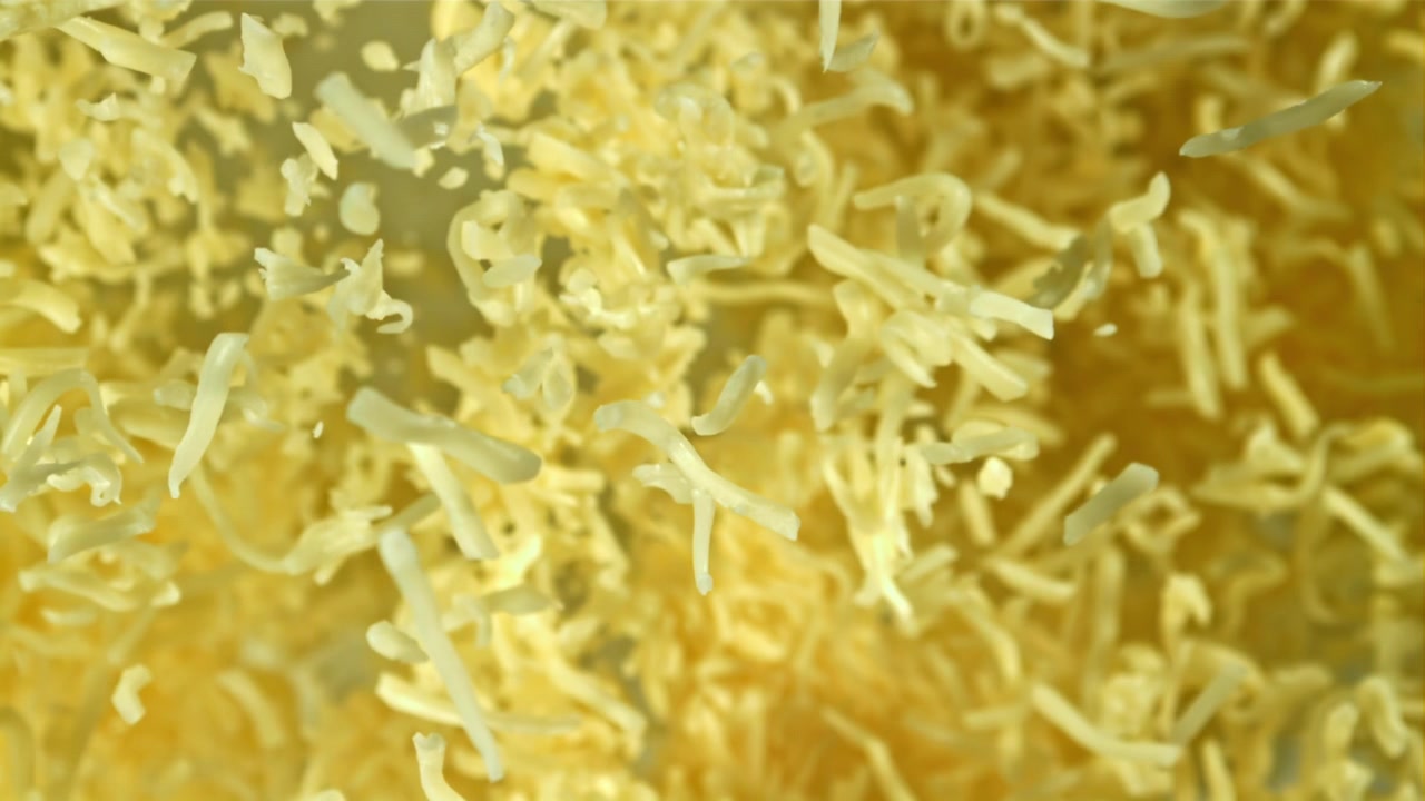 Shredded Cheese Falling in Slow Motion