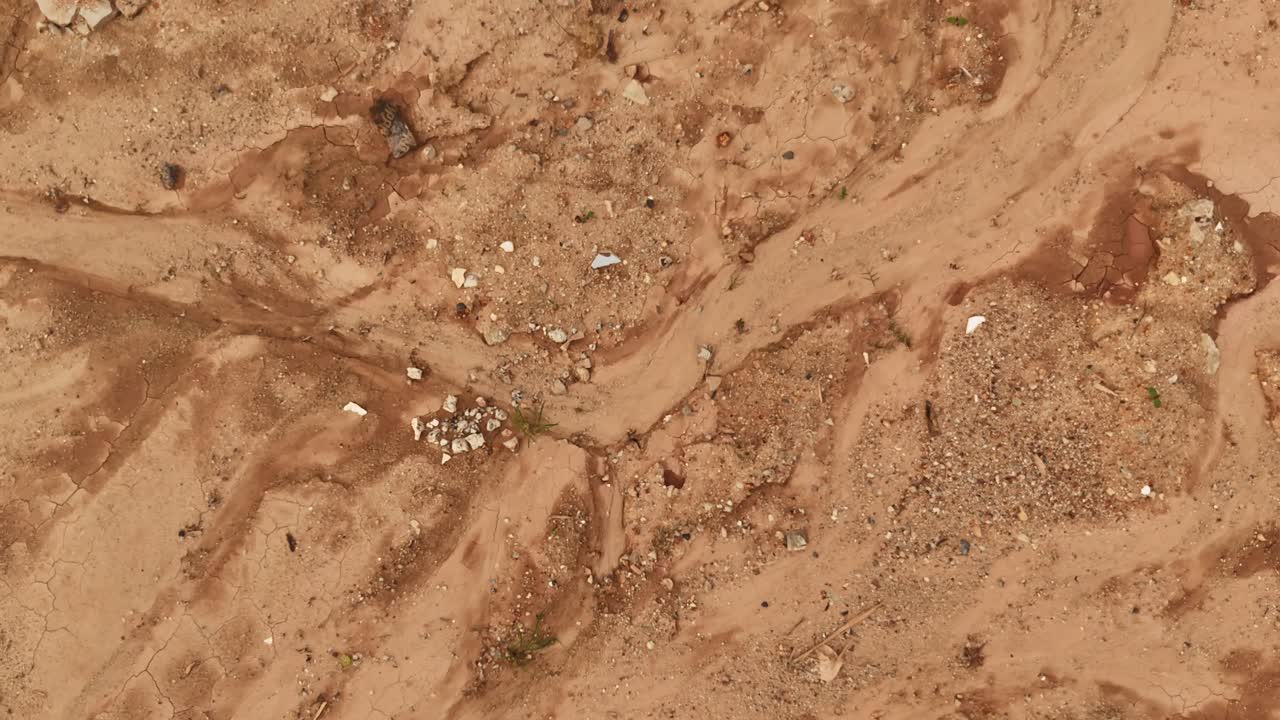 Dry, Cracked Earth with Debris