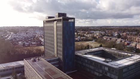 Pilkingtons-glass-head-quarters-blue-high-rise-business-office-park-aerial-rising-flyover-view