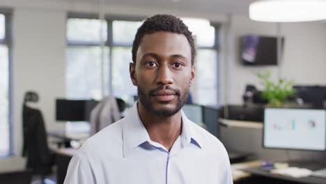portrait of happy african american businessman in office, slow motion