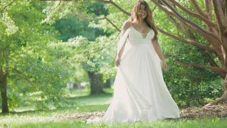 beautiful latina bride on wedding day in summer outdoor wedding wearing gorgeous white dress