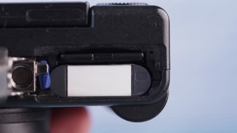 close-up of camera battery and memory card compartments