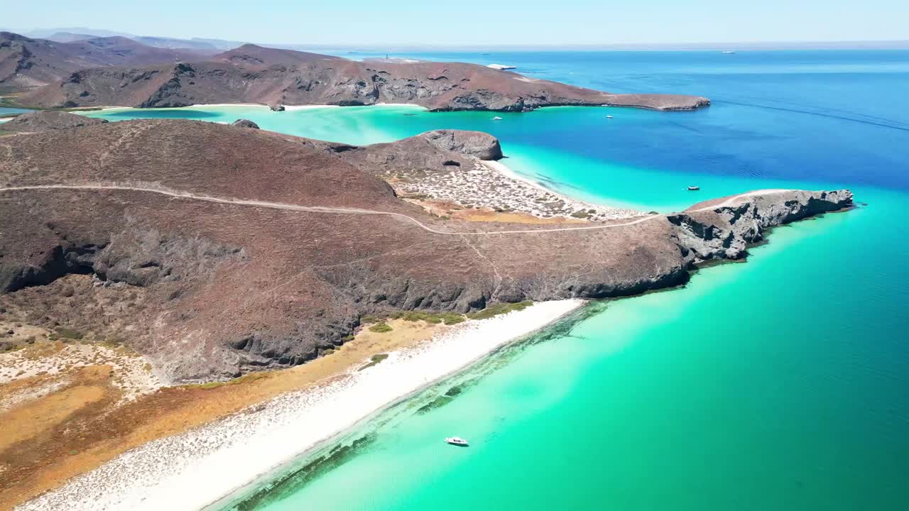 Stunning aerial view of Tecolotito Beach in La Paz, Mexico with clear blue waters