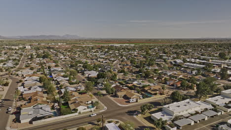 scottsdale arizona aerial v10 low drone flyover chateau de vie neighborhoods capturing rows of residential houses and townhouses with desert farmland views - shot with mavic 3 cine - february 2022