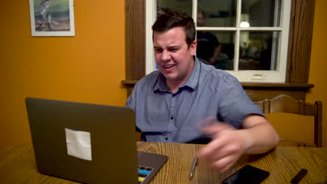 Man-very-stressed-out-about-something-on-his-laptop-computer