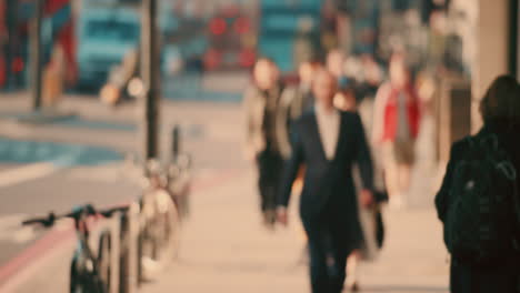 anonymous crowd of people walking  commuters london city street slow motion