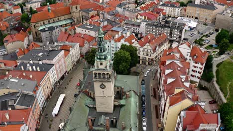 tower of klodzko town hall surrounded by townhouses in old town of klodzko in poland