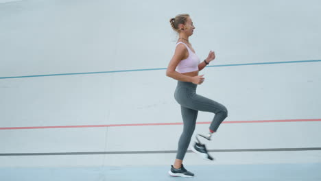 athlete jogging on racetrack