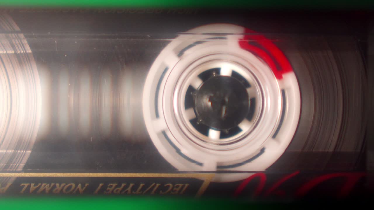 Audio сassette tape reel playing close up