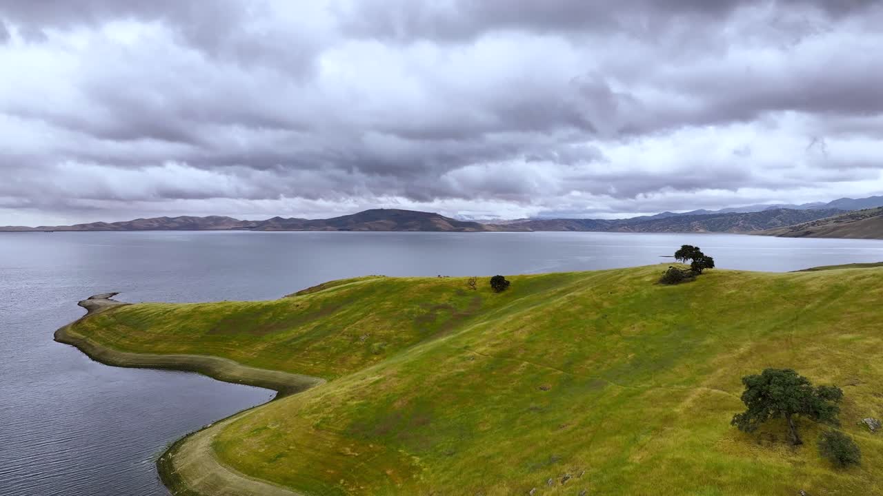 Aerial view of clouds passing over a lake
