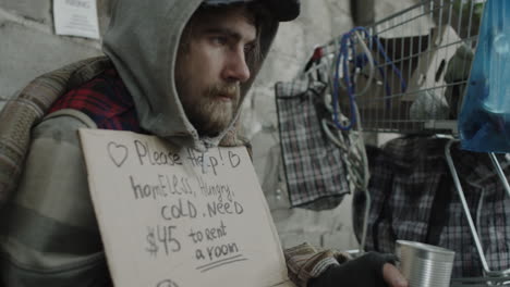 homeless man begging for money on the street