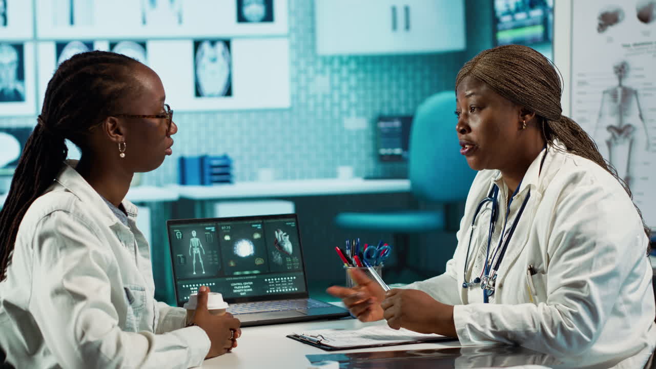 Healthcare professional consulting a female patient in a clinic office
