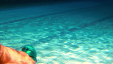 Fit-man-swimming-underwater-in-the-pool