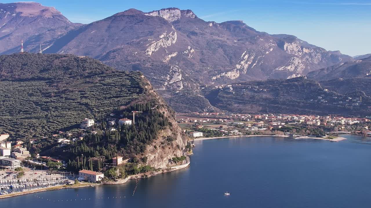Majestic mountains rise above scenic lake in Italy's Alps