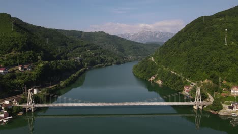 drone view of mountain bordering bosnia, aerial view of neretva river view in jablanica city bosnia and herzegovina