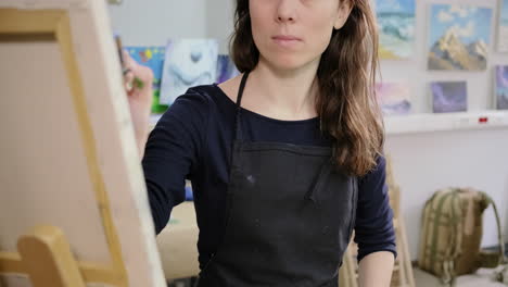 woman painting in art studio