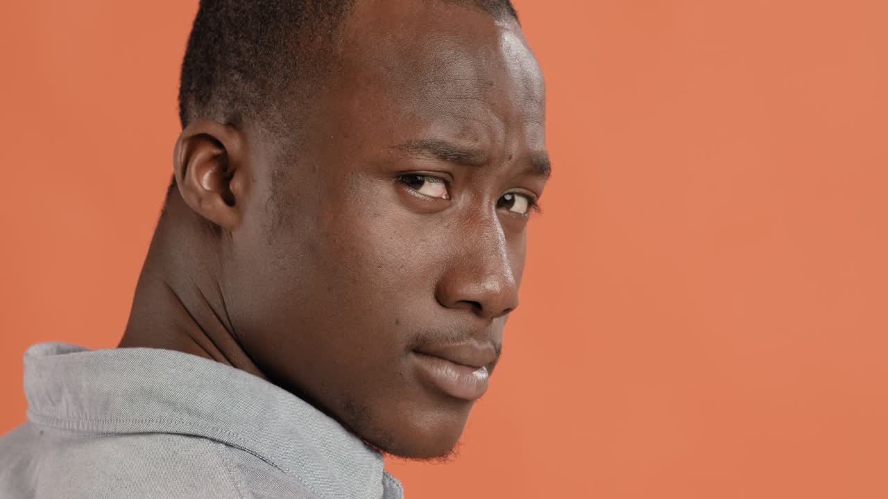 Close-up portrait of a man looking sideways