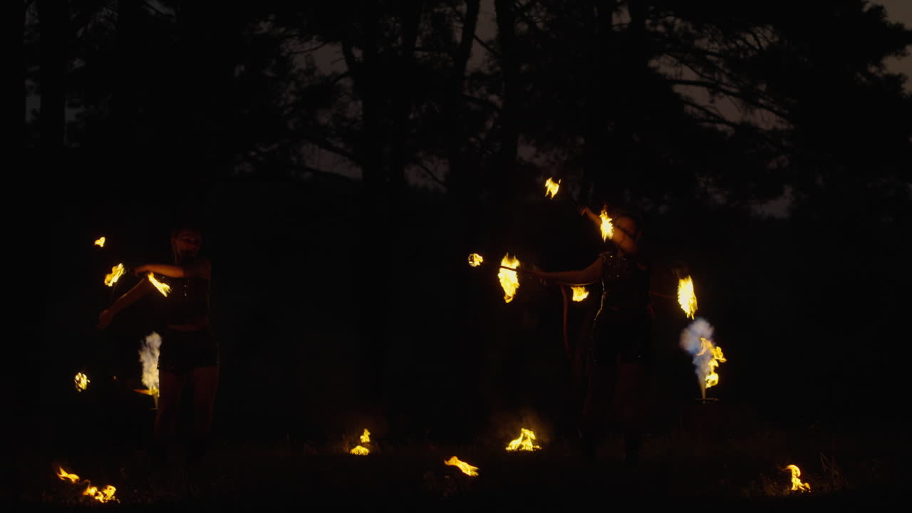Fire Dancers in the Night Forest