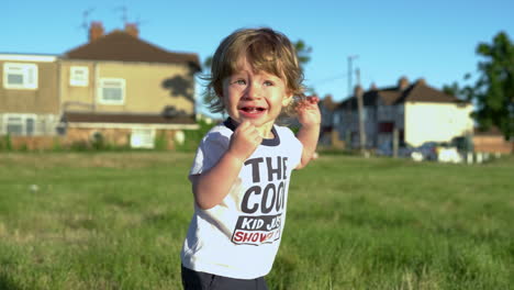 adorable toddler watching over head to see planes, being a bit scared