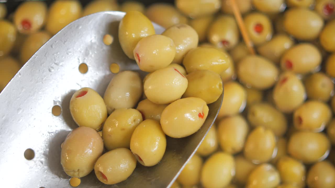 Pickled Green Olives in a Colander
