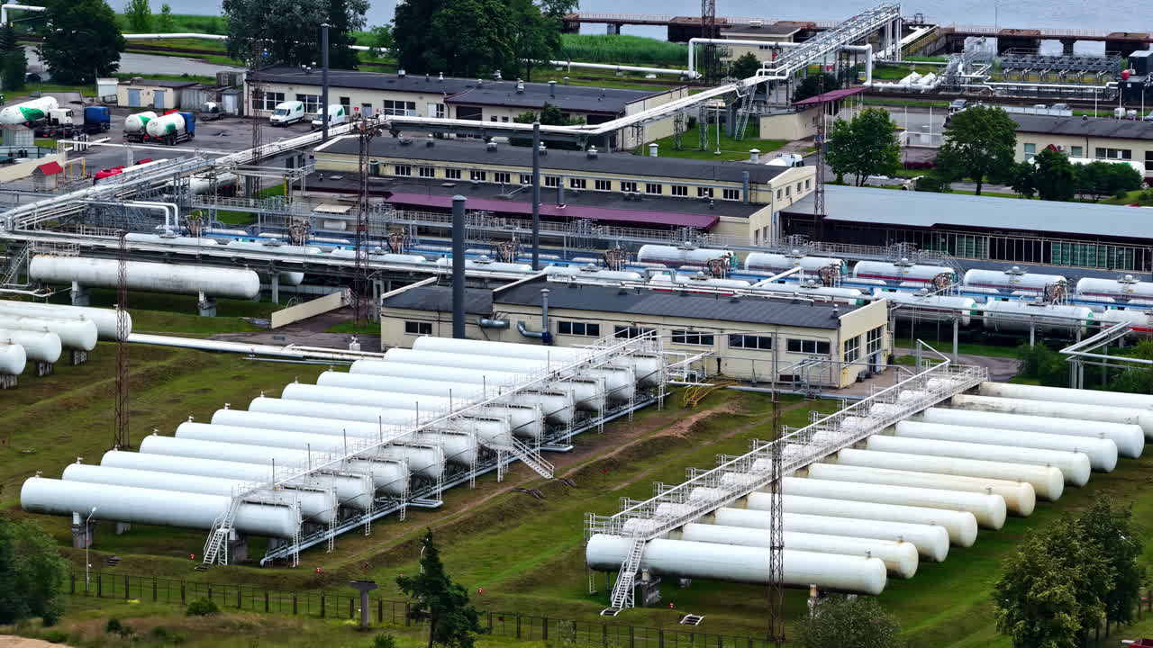 An aerial close-up shows rows of white horizontal bullet tanks at the Latvijas Propāna Gāze terminal in Riga, a storage and logistics depot for liquefied petroleum gas (LPG) fuel