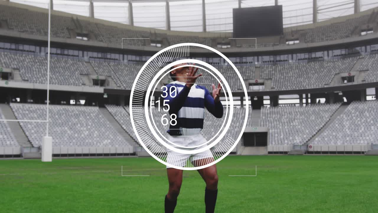 Athlete shifting stance and adjusting while overlay updating data in empty stadium securing catch