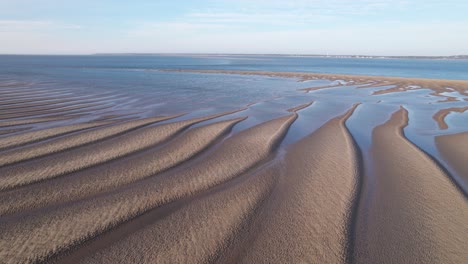 surreal landscape of sand dunes by the seashore in summer