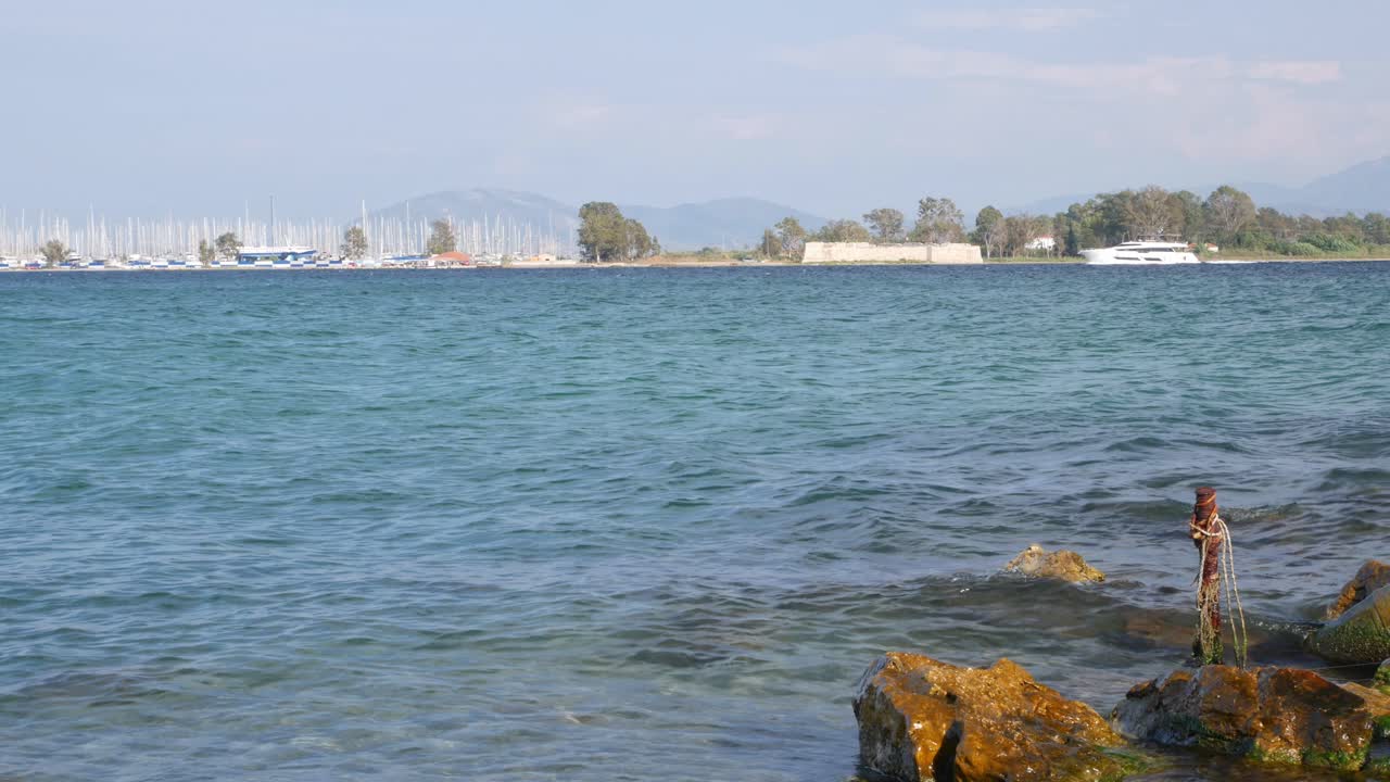 Luxury yacht crossing in front of the Cleopatra Marina, Preveza, Greece