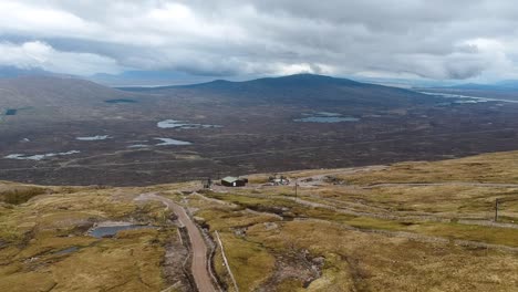 Cinematic-drone-tilting-shot-of-cloudy-highland-mountains