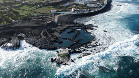 fantastic aerial shot of the coast of agaete and specifically of its natural pools where the ocean breaks the coast with force