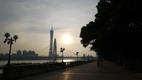 sunset guangzhou bridge canton tower riverside promenade bay slow motion panorama 4k china