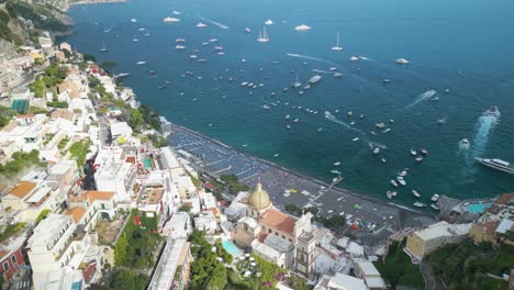 aerial pullback reveals positano bay along famous amalfi coast in italy