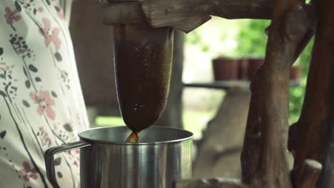 Woman-makes-traditional-pour-over-coffee-in-Costa-Rica-with-cotton-filter