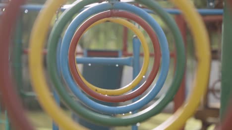 colorful circular pipes as obstacles in kindergarten playground