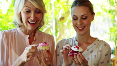 Female-friends-having-sweet-food-at-restaurant-4k