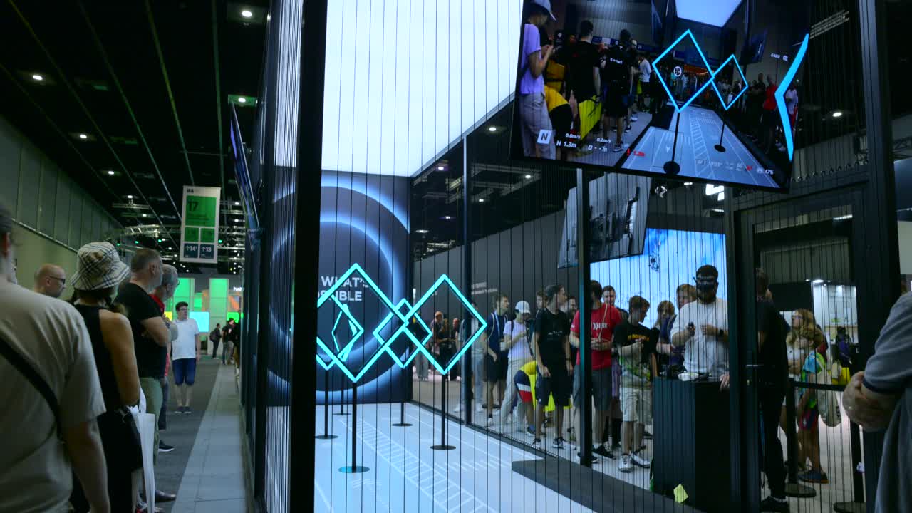 People exploring DJI stand at IFA, Berlin, with interactive tech displays and drone demos