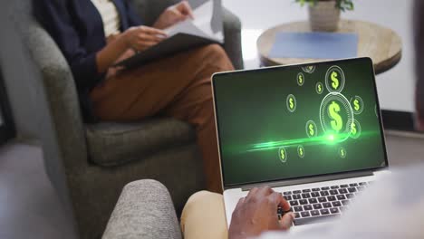 african american businessman using laptop for video call with data processing