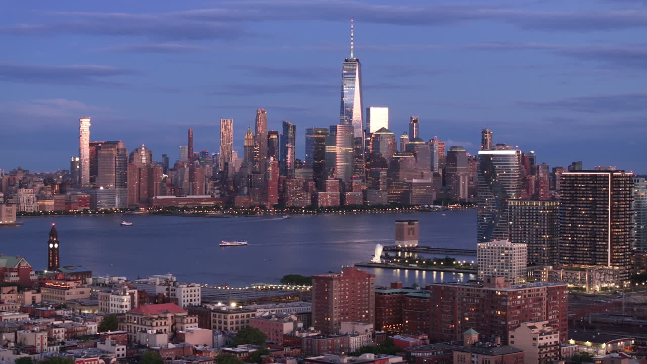 Aerial view of Lower Manhattan at night. Shot in Hoboken, New Jersey with the World Trade Center and the East River in the background.