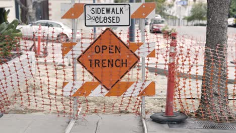 orange open trench sidewalk closed sign usa