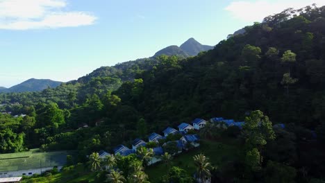 Aerial-View:-Scenic-view-of-a-Resort-Surrounded-by-a-dense-Tropical-Jungles-on-Koh-Chang-Island-in-Thailand