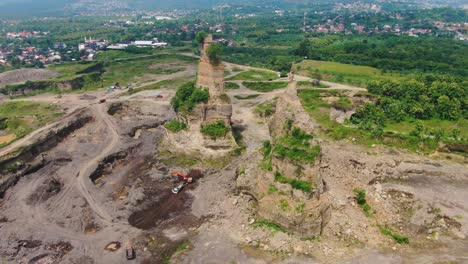 Rock-columns-in-Brown-Canyon-opencast-mine-in-Semarang,-Indonesia,-aerial-view