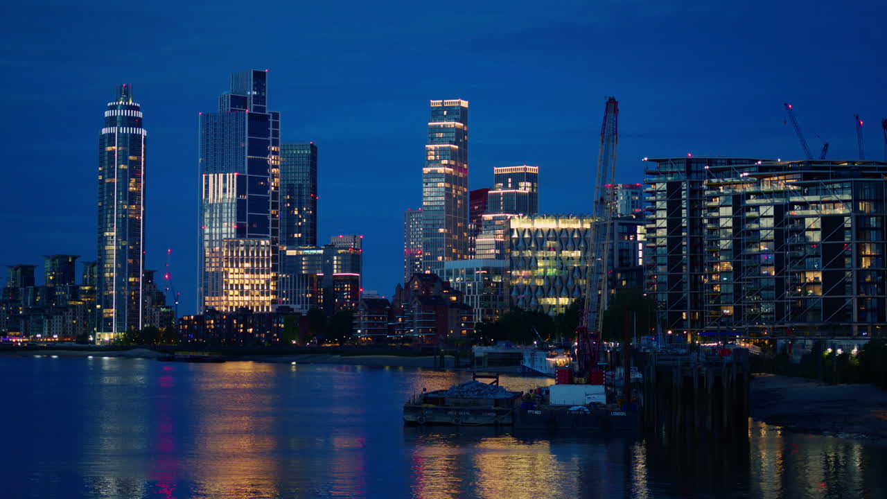 Cityscape of the London at evening, United Kingdom. Thames river and skyscrapers with illumination